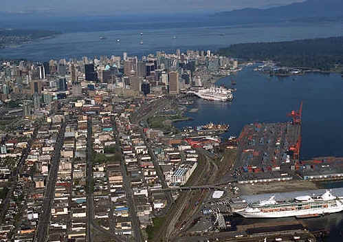 View of Downtown Vancouver.  Royal Caribbean's Vision of the Seas is in the foreground at Ballantyne Pier.  Downtown Vancouver and Canada Place are in background.